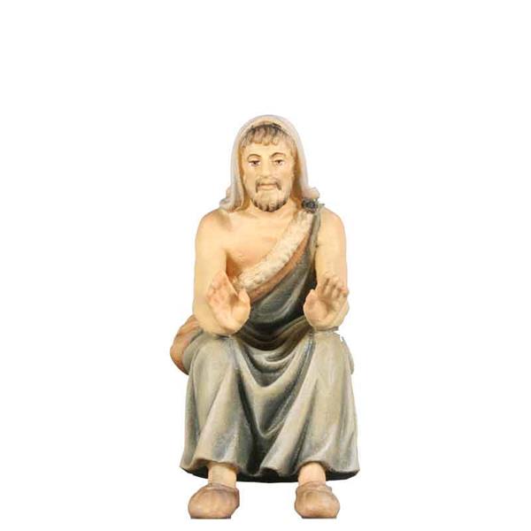 Hirt sitzend für Lagerfeuer Hirt sitzend für Lagerfeuer