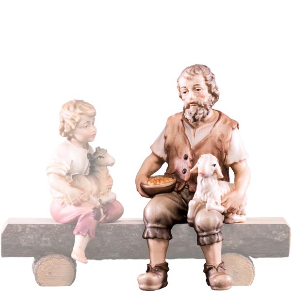 Hirt sitzend mit Lamm