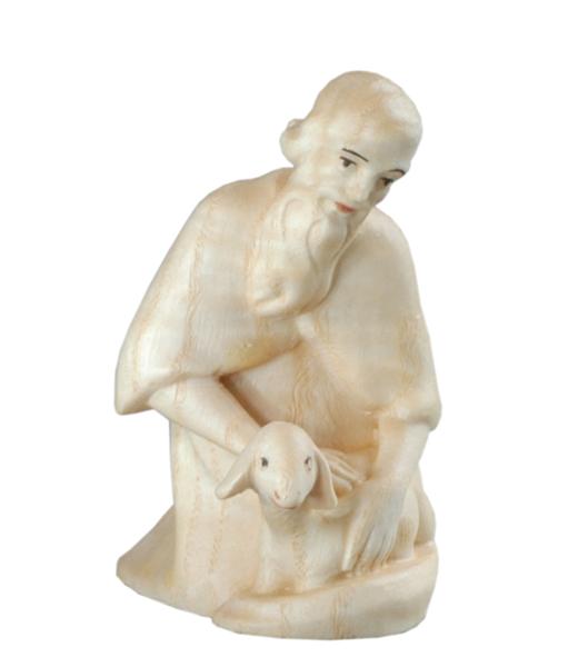 Hirte kniend mit Schaf Hirte kniend mit Schaf