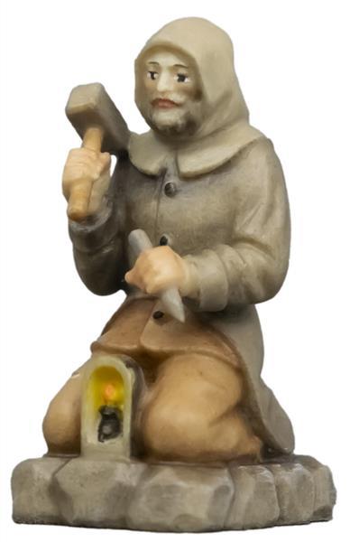 Berghäuer kniend mit Hammer und Meisel Berghäuer kniend mit Hammer und Meisel