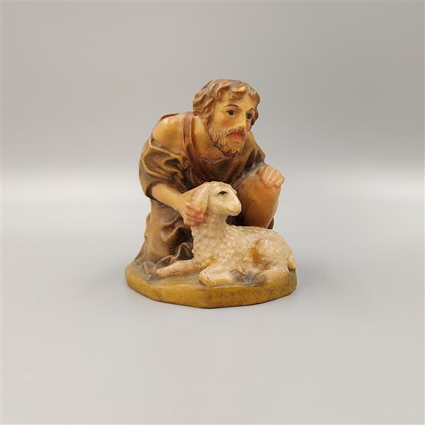 Hirt kniend mit Schaf Hirt kniend mit Schaf