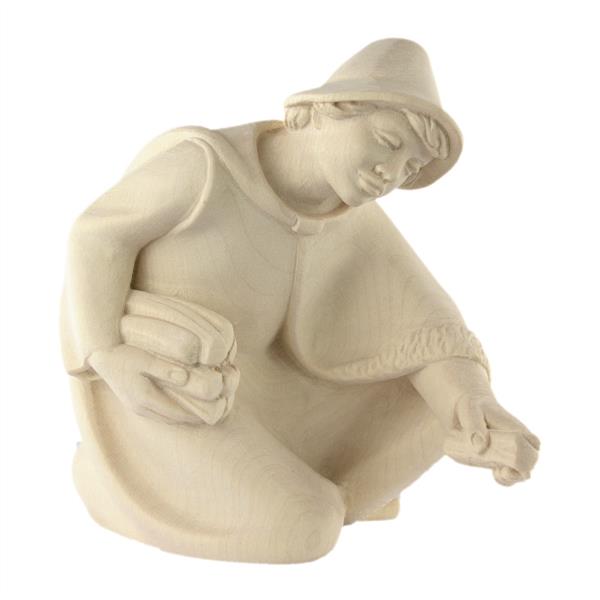 Hirte kniend mit Holz Hirte kniend mit Holz