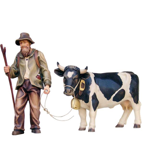 Almabtrieb Bauer mit Kuh schwarz-weiß fleckig