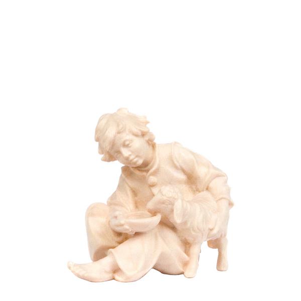 Junge sitzend mit Schaf Junge sitzend mit Schaf