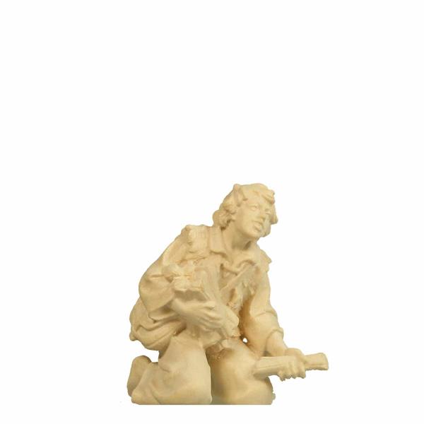 Hirt kniend am Lagerfeuer Hirt kniend am Lagerfeuer