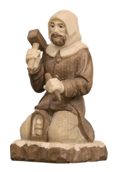 Berghäuer kniend mit Hammer und Meisel Berghäuer kniend mit Hammer und Meisel