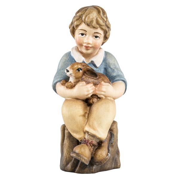 Junge sitzend mit Hase Junge sitzend mit Hase