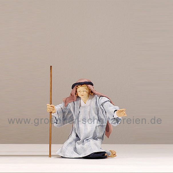 Junge kniend orient.