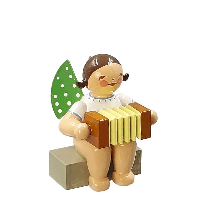 Engel mit Harmonika sitzend
