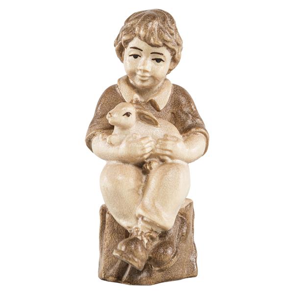 Junge sitzend mit Hase