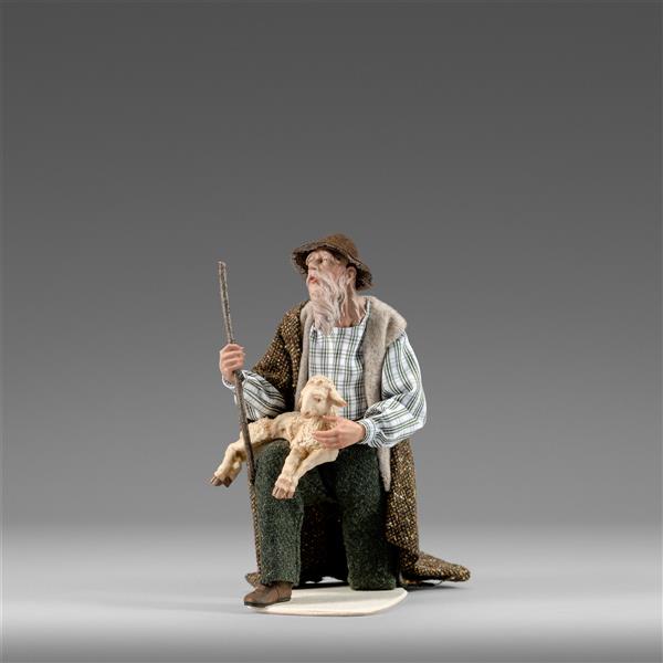 Hirte kniend mit Lamm Hirte kniend mit Lamm